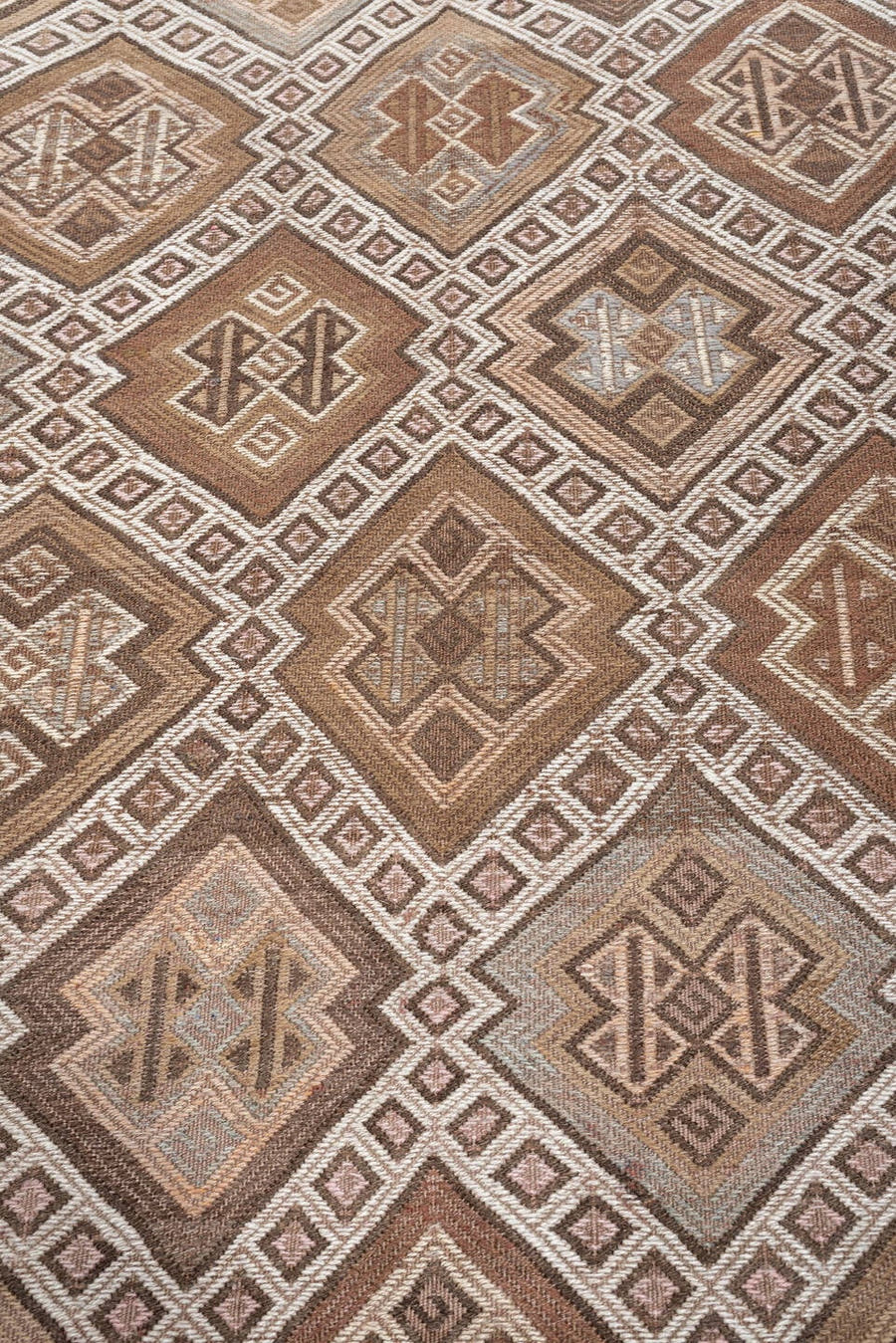 5' x 14' one-of-a-kind handmade antique Jijim rug. Color palette: taupe, ivory, camel, dusty rose, rust, brown, charcoal
