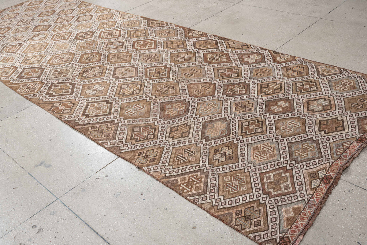5' x 14' one-of-a-kind handmade antique Jijim rug. Color palette: taupe, ivory, camel, dusty rose, rust, brown, charcoal