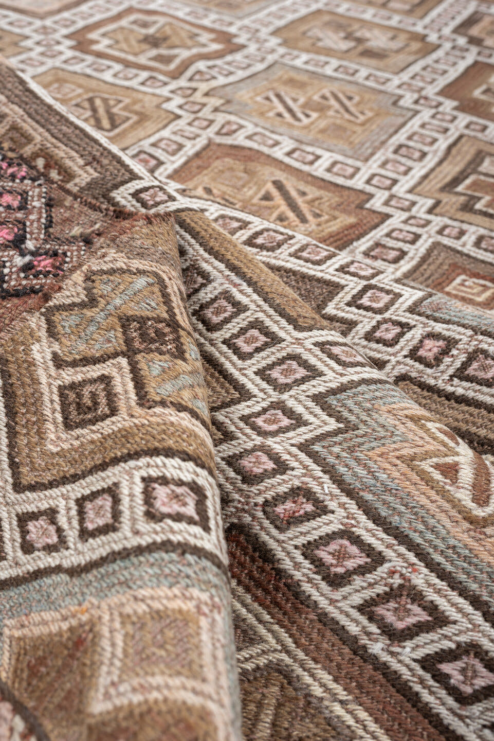 5' x 14' one-of-a-kind handmade antique Jijim rug. Color palette: taupe, ivory, camel, dusty rose, rust, brown, charcoal