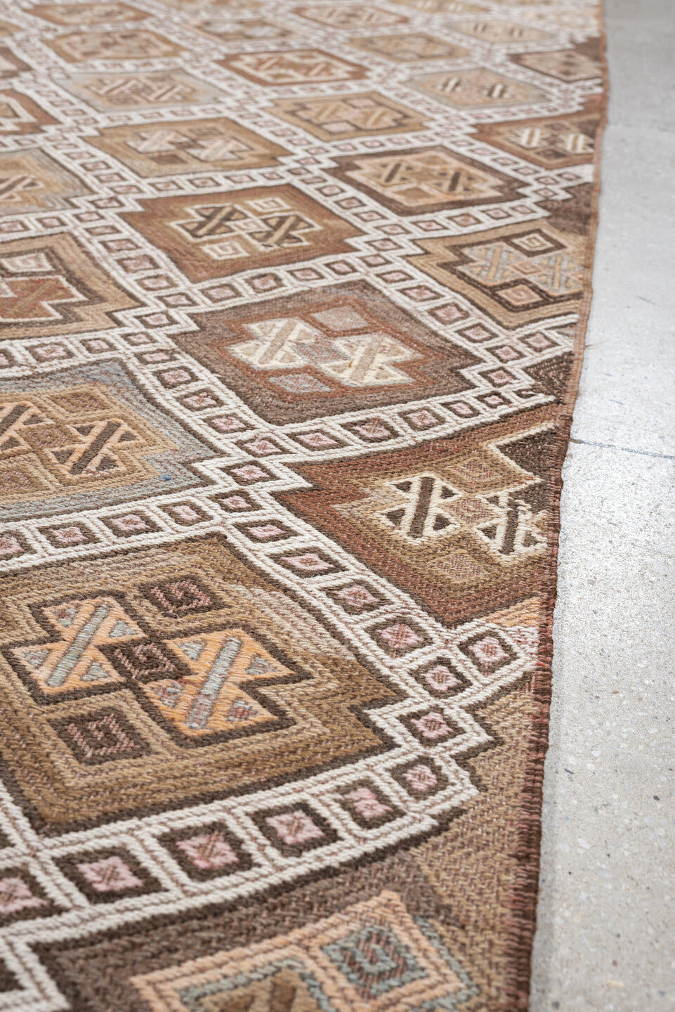 5' x 14' one-of-a-kind handmade antique Jijim rug. Color palette: taupe, ivory, camel, dusty rose, rust, brown, charcoal
