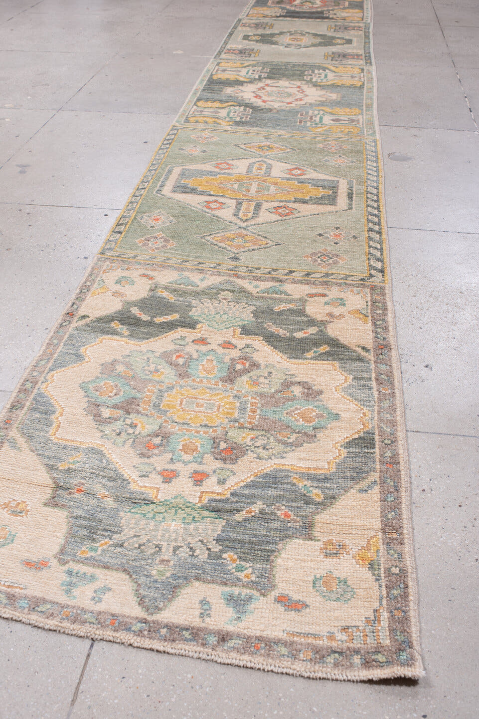 2' x 32' one-of-a-kind handmade vintage Oushak runner rug. Color palette: sage, aqua, ivory, terracotta, ochre, coral