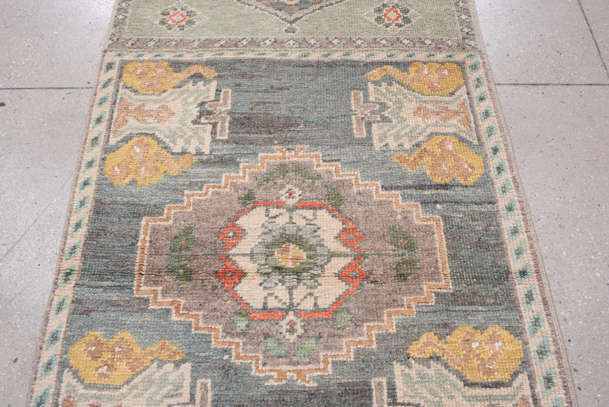 2' x 32' one-of-a-kind handmade vintage Oushak runner rug. Color palette: sage, aqua, ivory, terracotta, ochre, coral