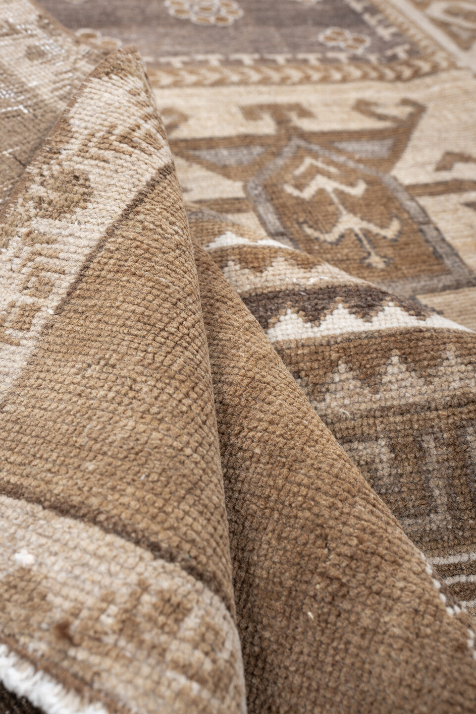 6' x 9' one-of-a-kind handmade antique Kars medium size rug. Color palette: camel, taupe, ivory, brown, charcoal, sand