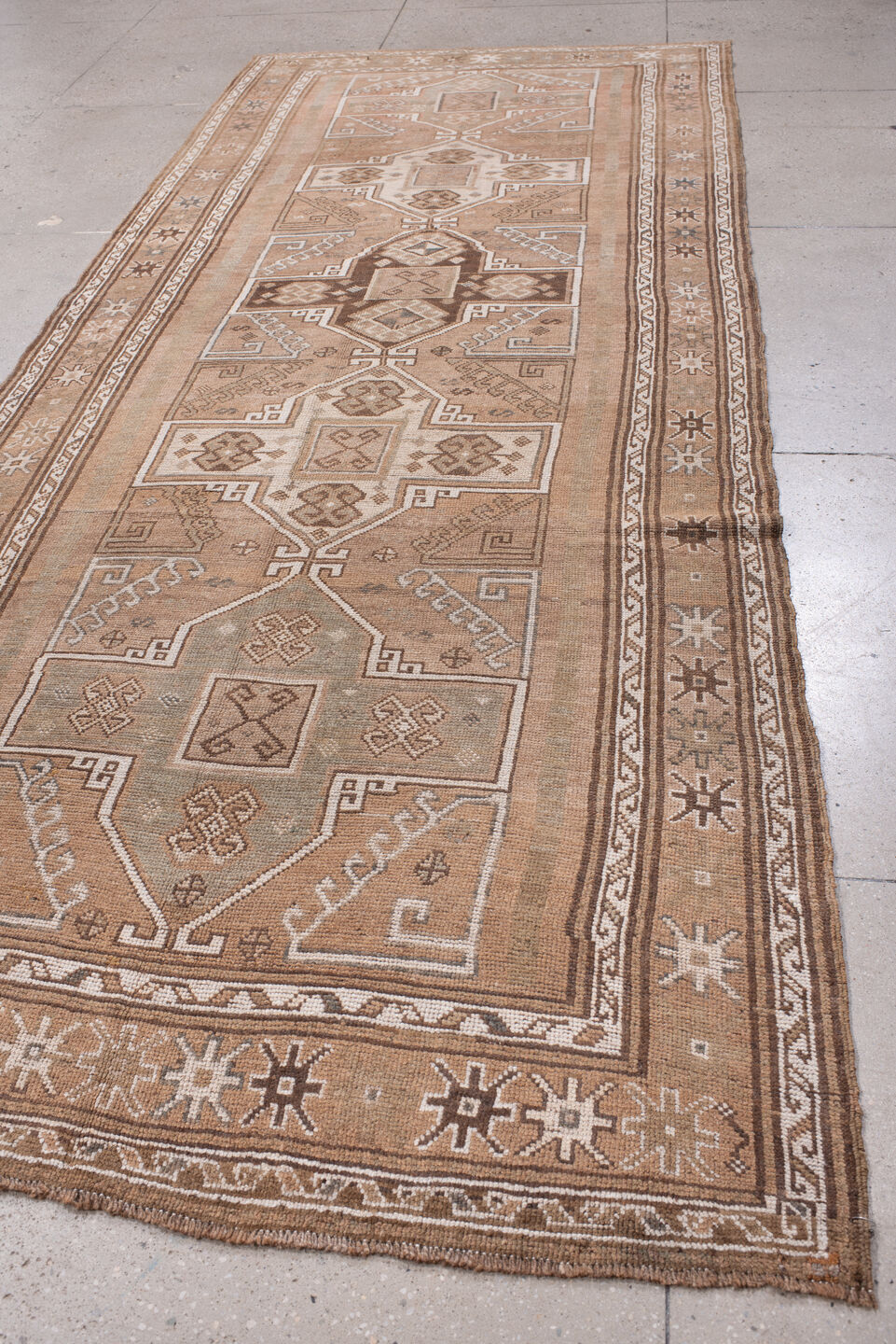4' x 12' one-of-a-kind handmade antique Kars runner rug. Color palette: camel, taupe, ivory, brown, beige, charcoal, gray