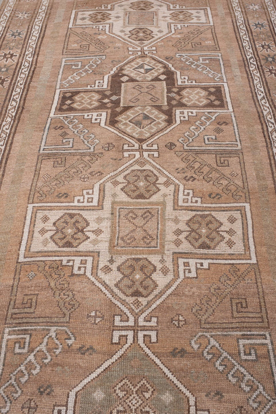 4' x 12' one-of-a-kind handmade antique Kars runner rug. Color palette: camel, taupe, ivory, brown, beige, charcoal, gray