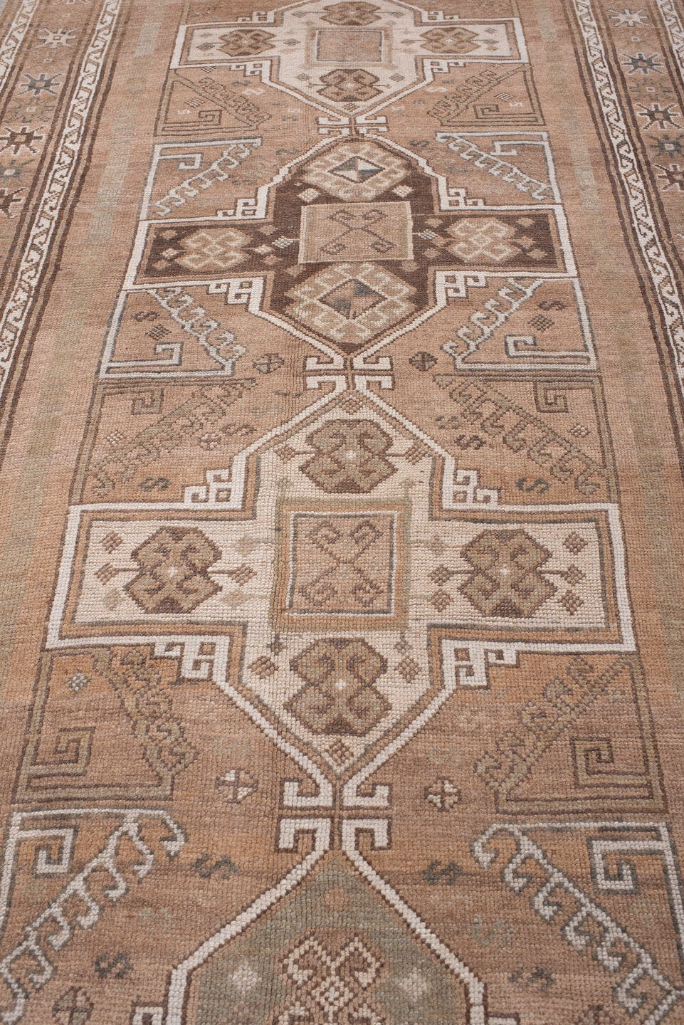 4' x 12' one-of-a-kind handmade antique Kars runner rug. Color palette: camel, taupe, ivory, brown, beige, charcoal, gray