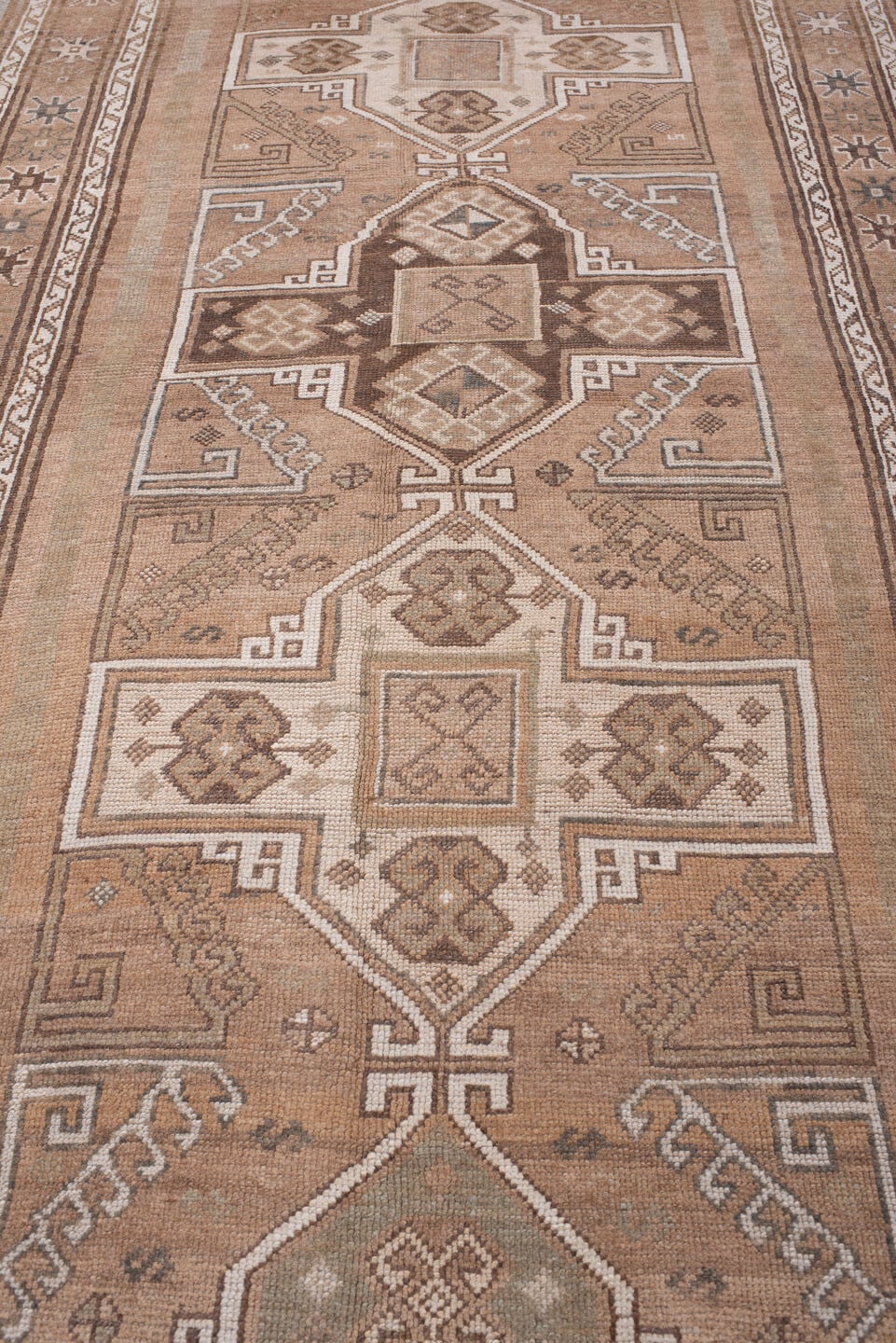 4' x 12' one-of-a-kind handmade antique Kars runner rug. Color palette: camel, taupe, ivory, brown, beige, charcoal, gray
