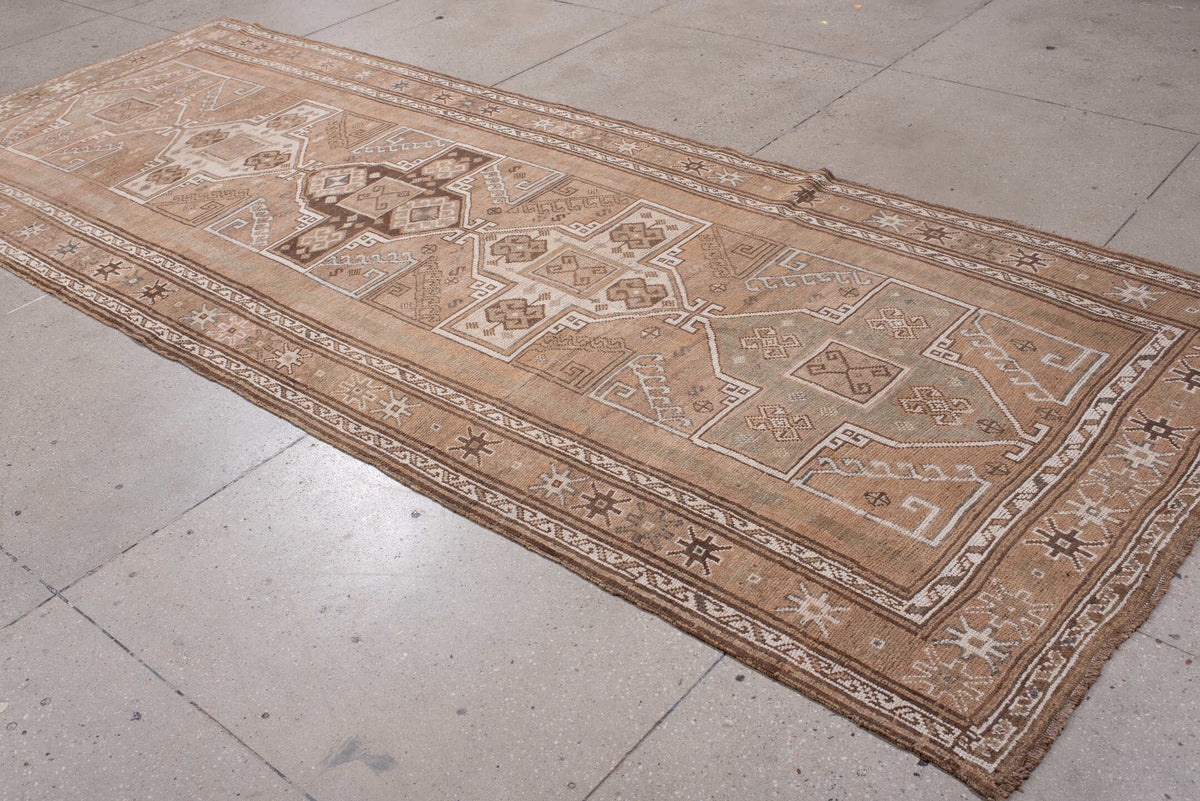 4' x 12' one-of-a-kind handmade antique Kars runner rug. Color palette: camel, taupe, ivory, brown, beige, charcoal, gray