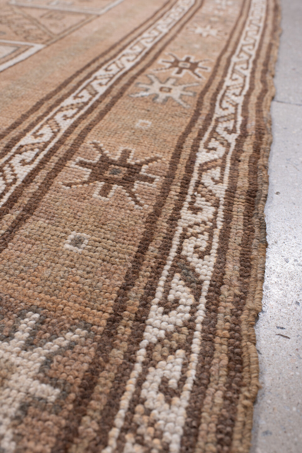4' x 12' one-of-a-kind handmade antique Kars runner rug. Color palette: camel, taupe, ivory, brown, beige, charcoal, gray