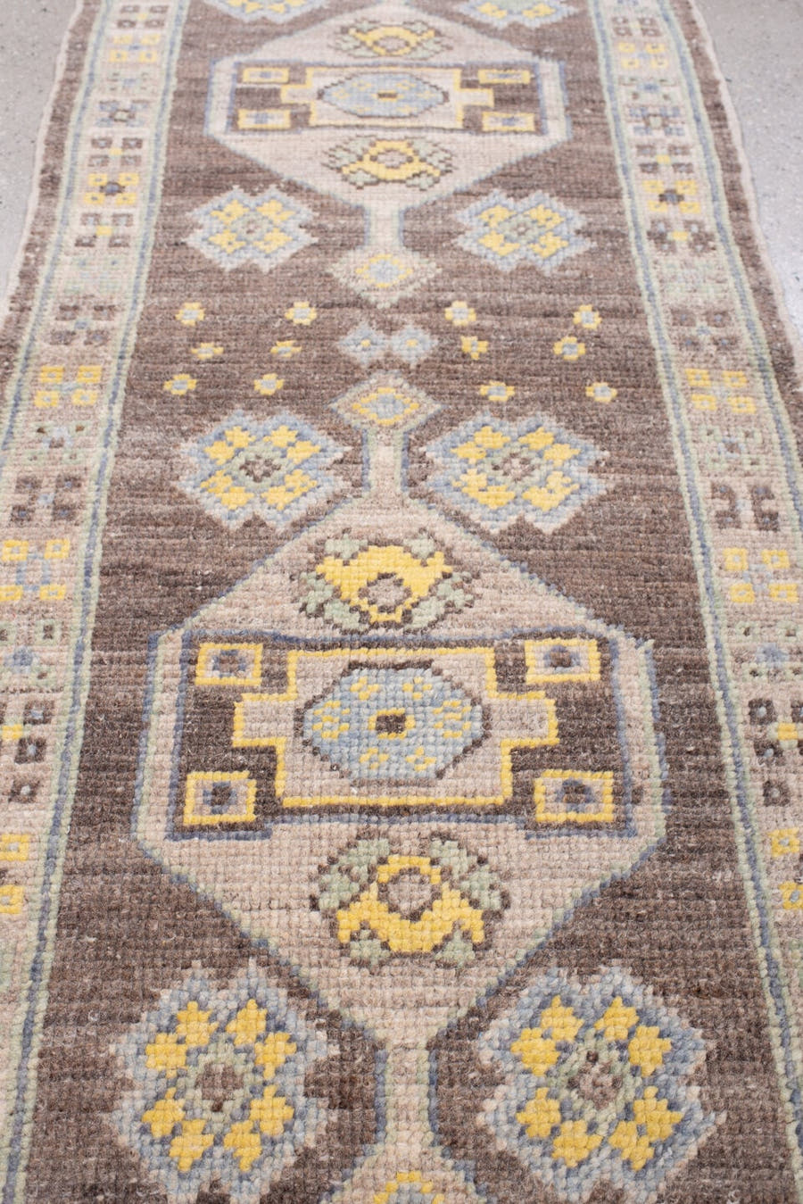 2' x 6' one-of-a-kind handmade vintage Oushak runner rug. Color palette: chocolate brown, ivory, pale blue, sage, soft gold