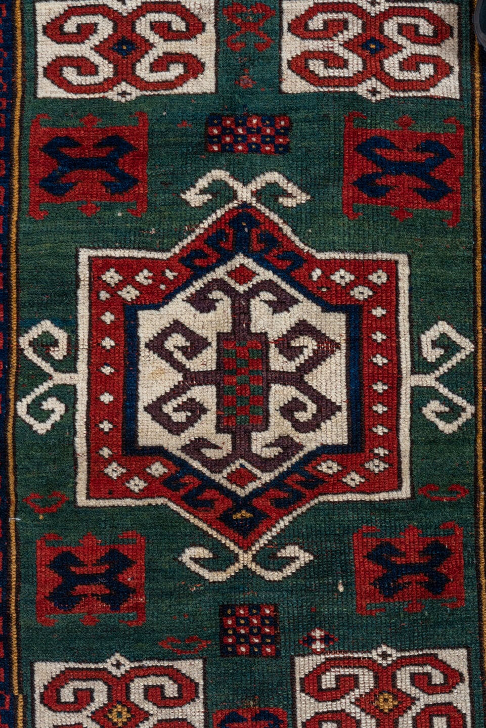 3' x 5' one-of-a-kind handmade vintage Kazak small size rug. Color palette: red, ivory, navy, teal, crimson, sage, burgundy