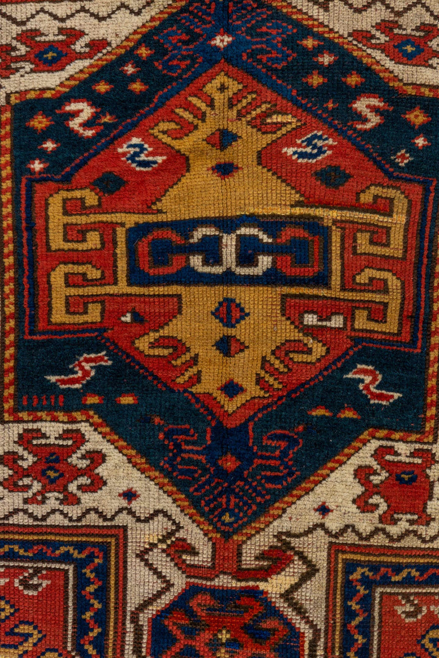 3' x 6' one-of-a-kind handmade vintage Kazak small size rug. Color palette: rust, ivory, navy, gold, crimson, camel, teal