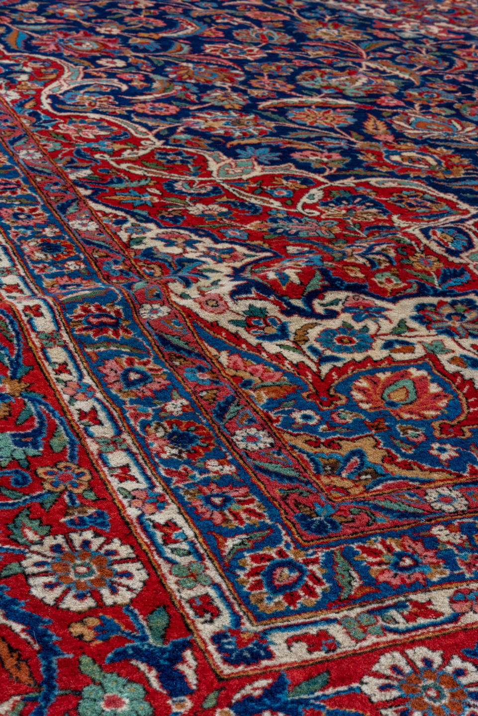 10' x 13' one-of-a-kind handmade vintage Kashan oversize rug. Color palette: navy, red, ivory, cobalt, rose, camel, blue