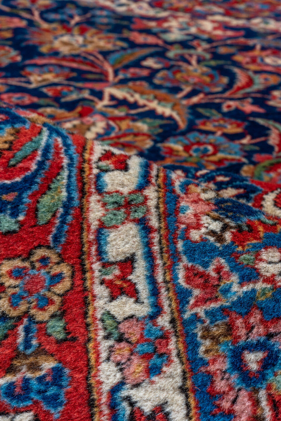 10' x 13' one-of-a-kind handmade vintage Kashan oversize rug. Color palette: navy, red, ivory, cobalt, rose, camel, blue