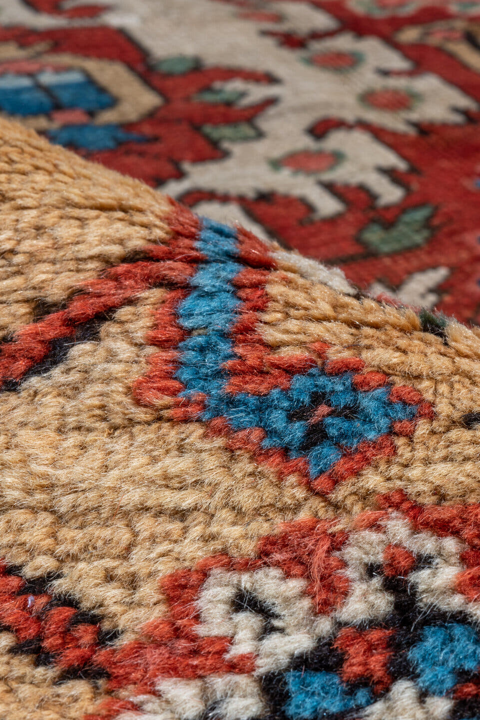 11' x 21' one-of-a-kind handmade antique Serapi oversize rug. Color palette: red, ivory, camel, blue, rose, rust, sage