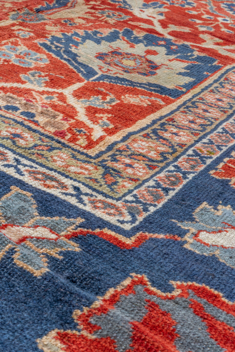 11' x 14' one-of-a-kind handmade vintage Sultanabad oversize rug. Color palette: rust, navy, ivory, slate, terra cotta