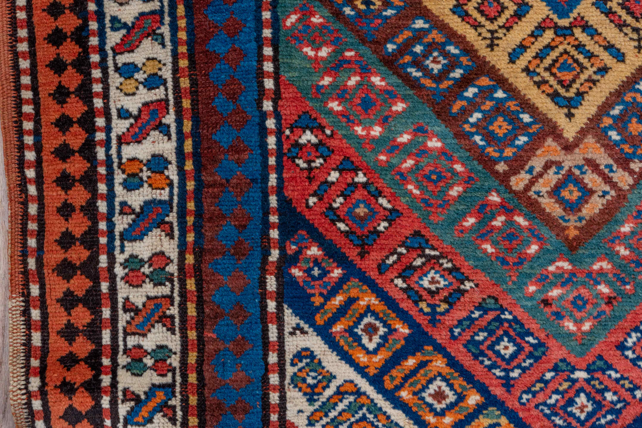 3' x 9' one-of-a-kind handmade vintage Genje runner rug. Color palette: rust, ivory, cobalt, navy, terra cotta, camel