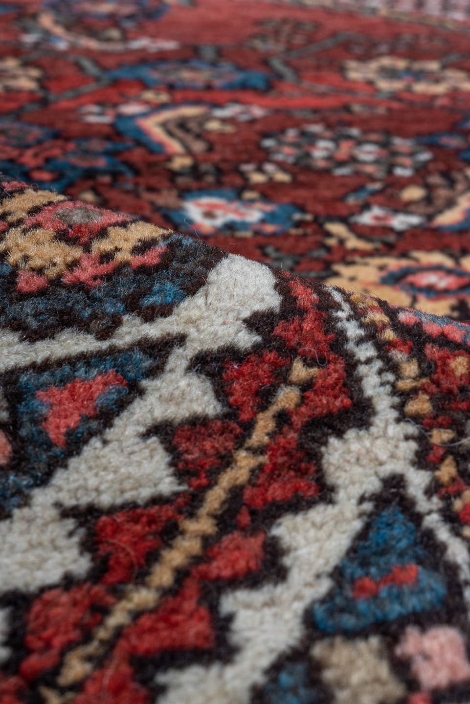 4' x 6' one-of-a-kind handmade vintage Kurd small size rug. Color palette: red, ivory, indigo, rust, navy, camel, burgundy