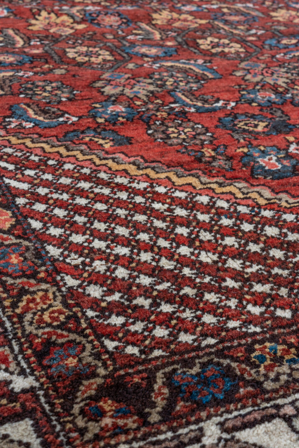 4' x 6' one-of-a-kind handmade vintage Kurd small size rug. Color palette: red, ivory, indigo, rust, navy, camel, burgundy