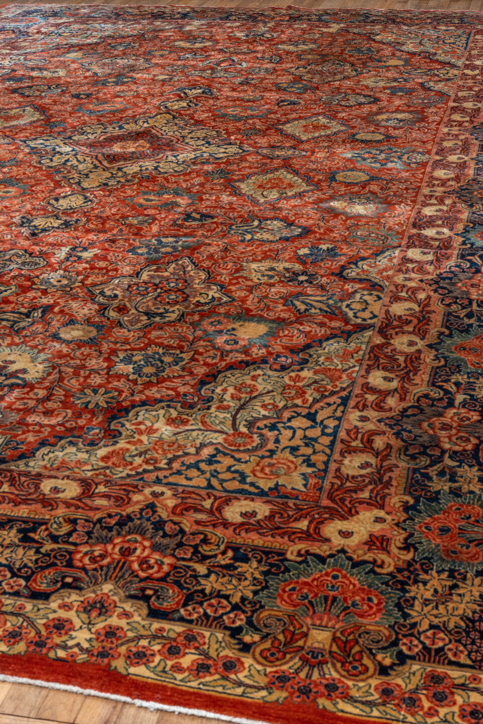 10' x 17' one-of-a-kind handmade vintage Sarouk rug. Color palette: red, navy, ivory, sky blue, rust, coral, camel, blue