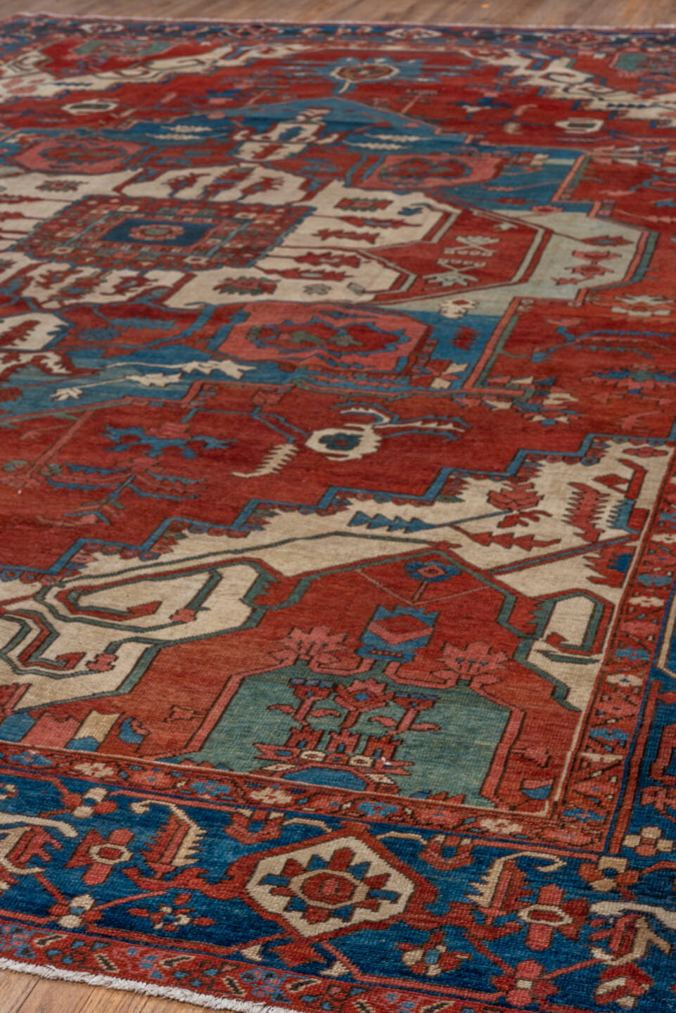 10' x 15' one-of-a-kind handmade vintage Serapi rug. Color palette: rust, sky blue, ivory, crimson, slate, rose, navy