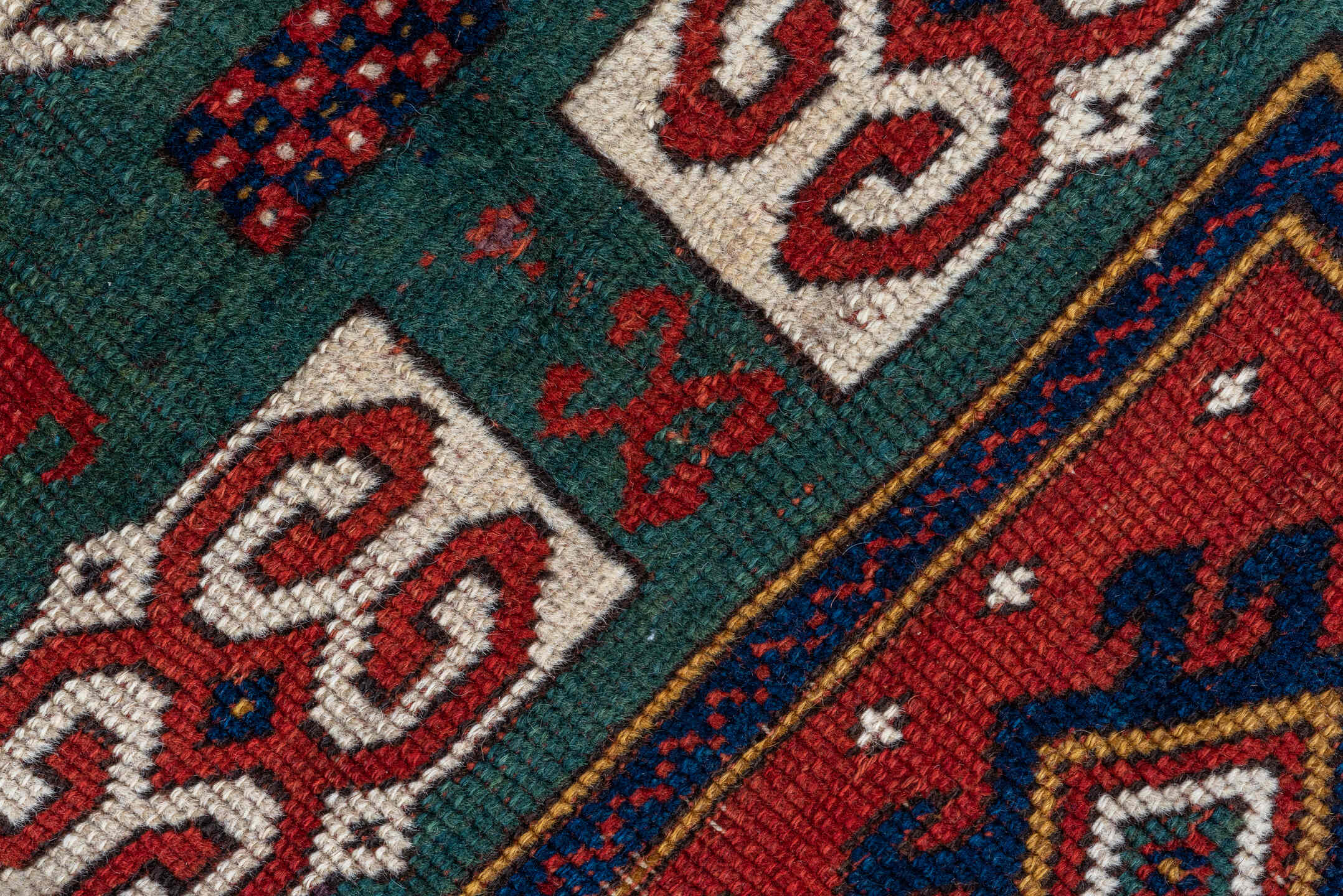 3' x 5' one-of-a-kind handmade vintage Kazak small size rug. Color palette: red, ivory, navy, teal, crimson, sage, burgundy