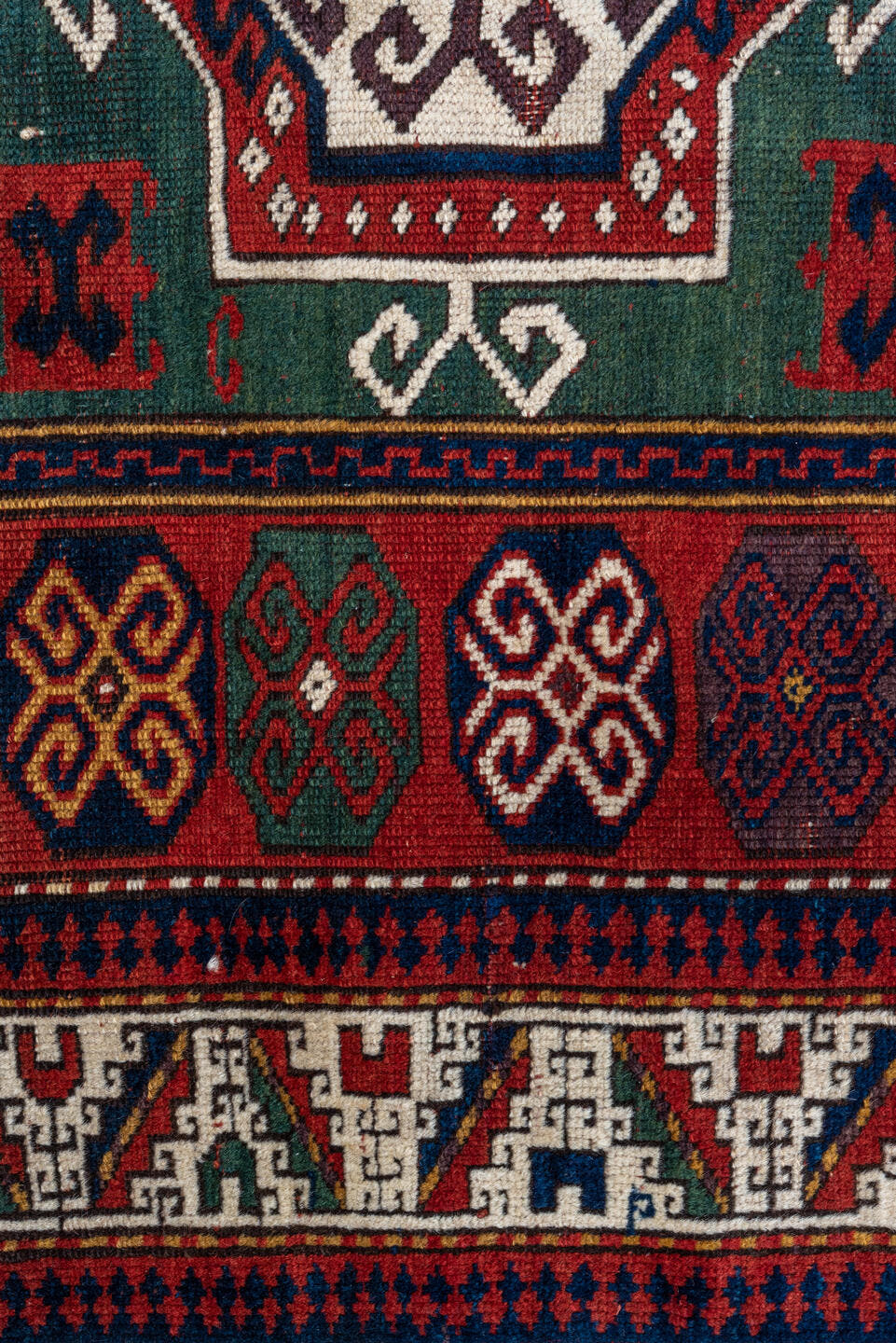 3' x 5' one-of-a-kind handmade vintage Kazak small size rug. Color palette: red, ivory, navy, teal, crimson, sage, burgundy