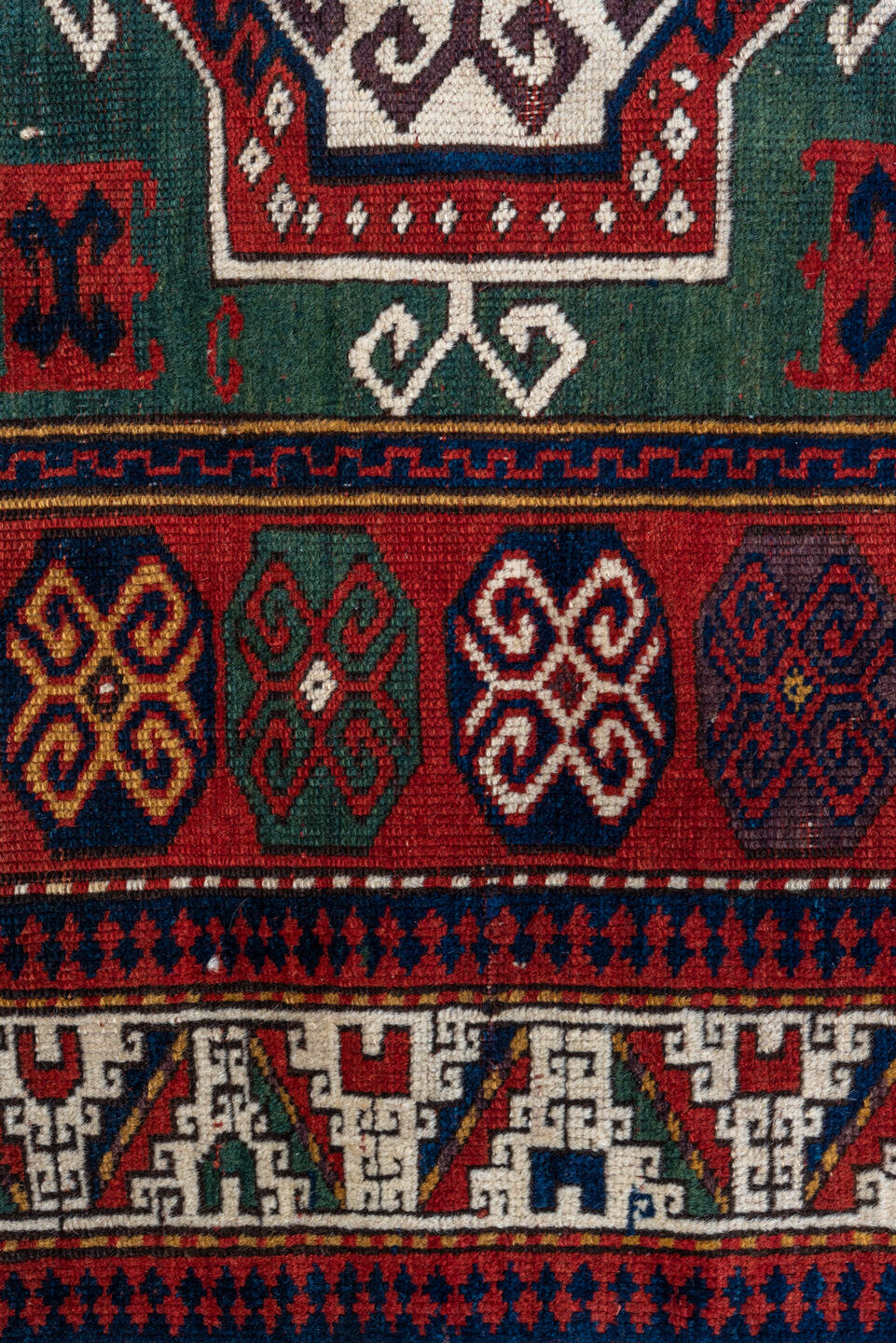 3' x 5' one-of-a-kind handmade vintage Kazak small size rug. Color palette: red, ivory, navy, teal, crimson, sage, burgundy