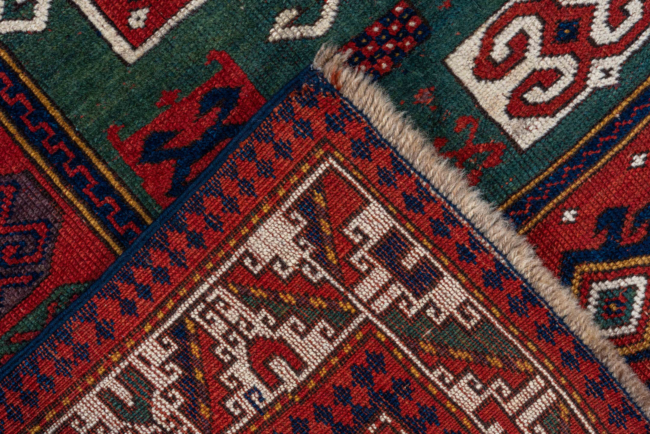 3' x 5' one-of-a-kind handmade vintage Kazak small size rug. Color palette: red, ivory, navy, teal, crimson, sage, burgundy