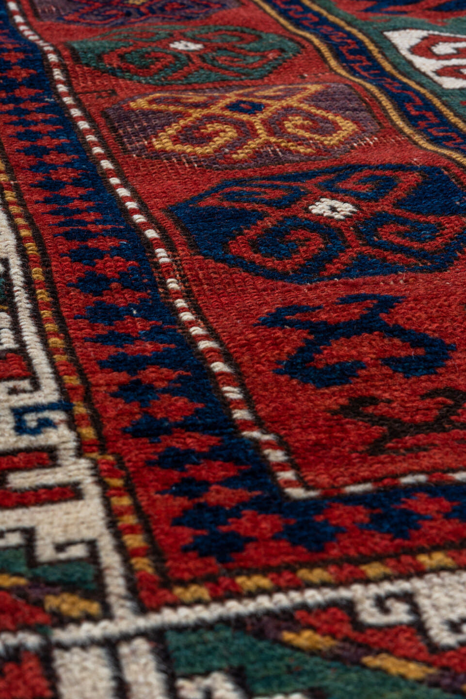 3' x 5' one-of-a-kind handmade vintage Kazak small size rug. Color palette: red, ivory, navy, teal, crimson, sage, burgundy