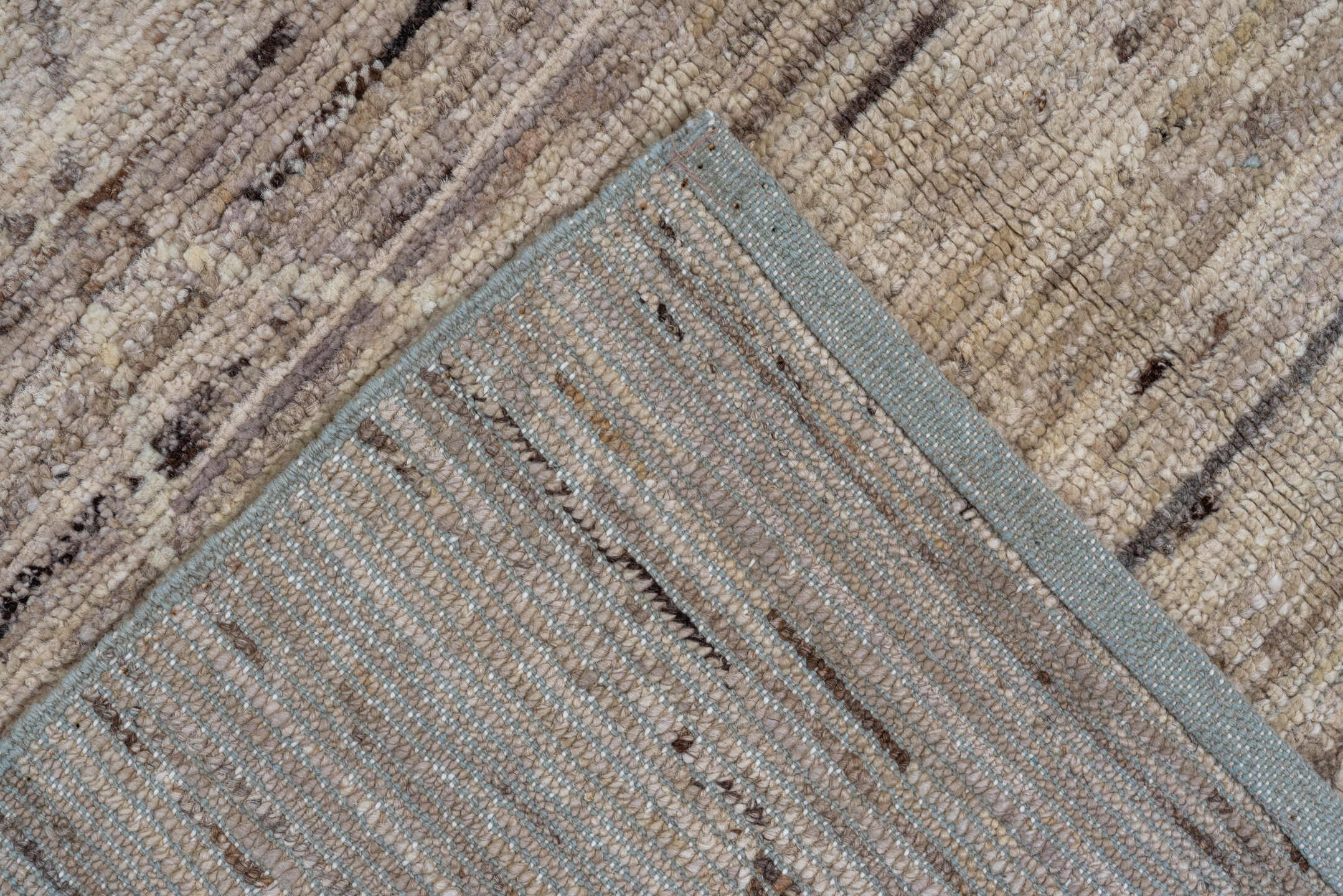 7' x 9' one-of-a-kind handmade vintage Tulu rug. Color palette: ivory, taupe, beige, brown, cream, gray