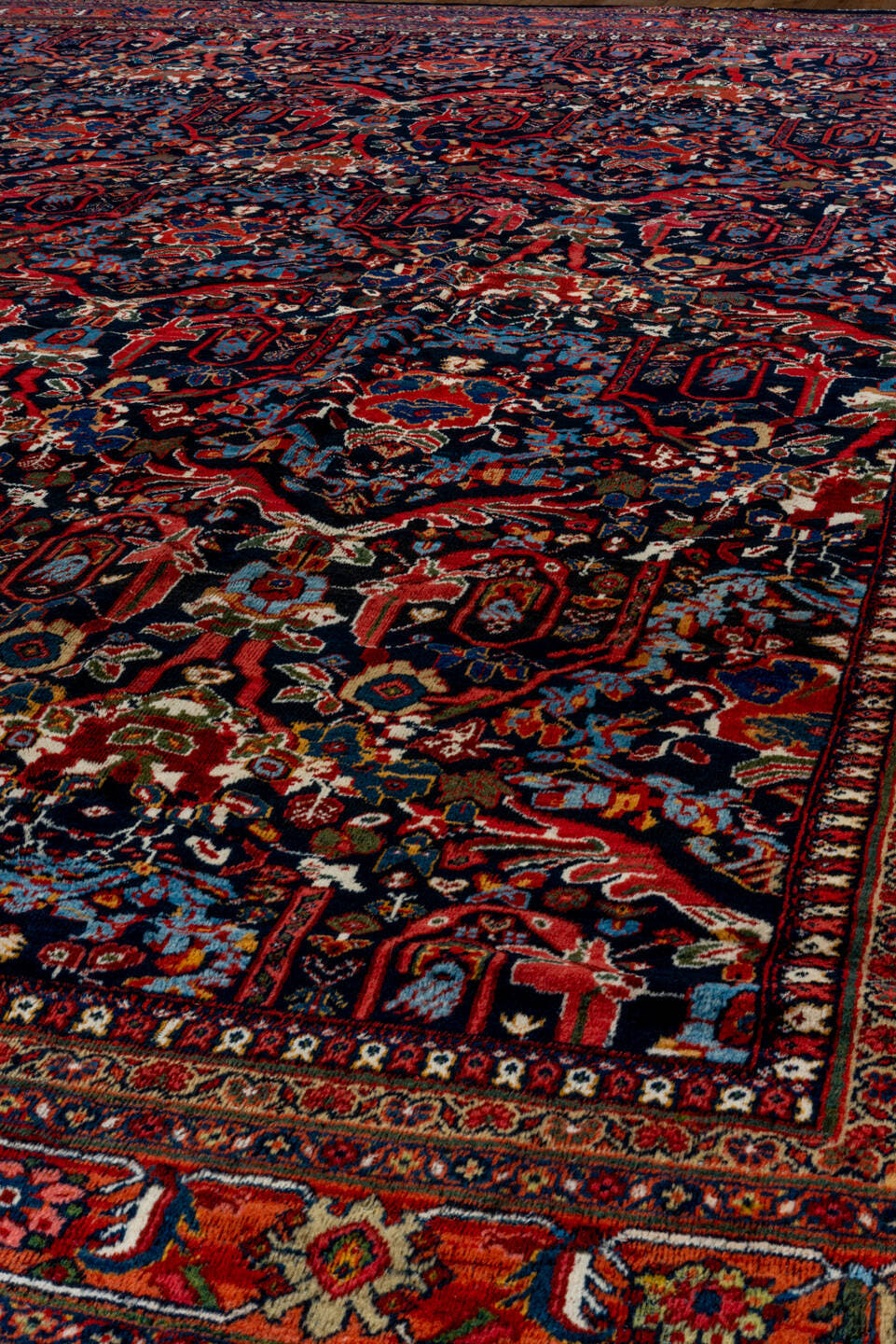12' x 17' one-of-a-kind handmade vintage Mahal oversize rug. Color palette: navy, rust, crimson, ivory, cobalt, charcoal