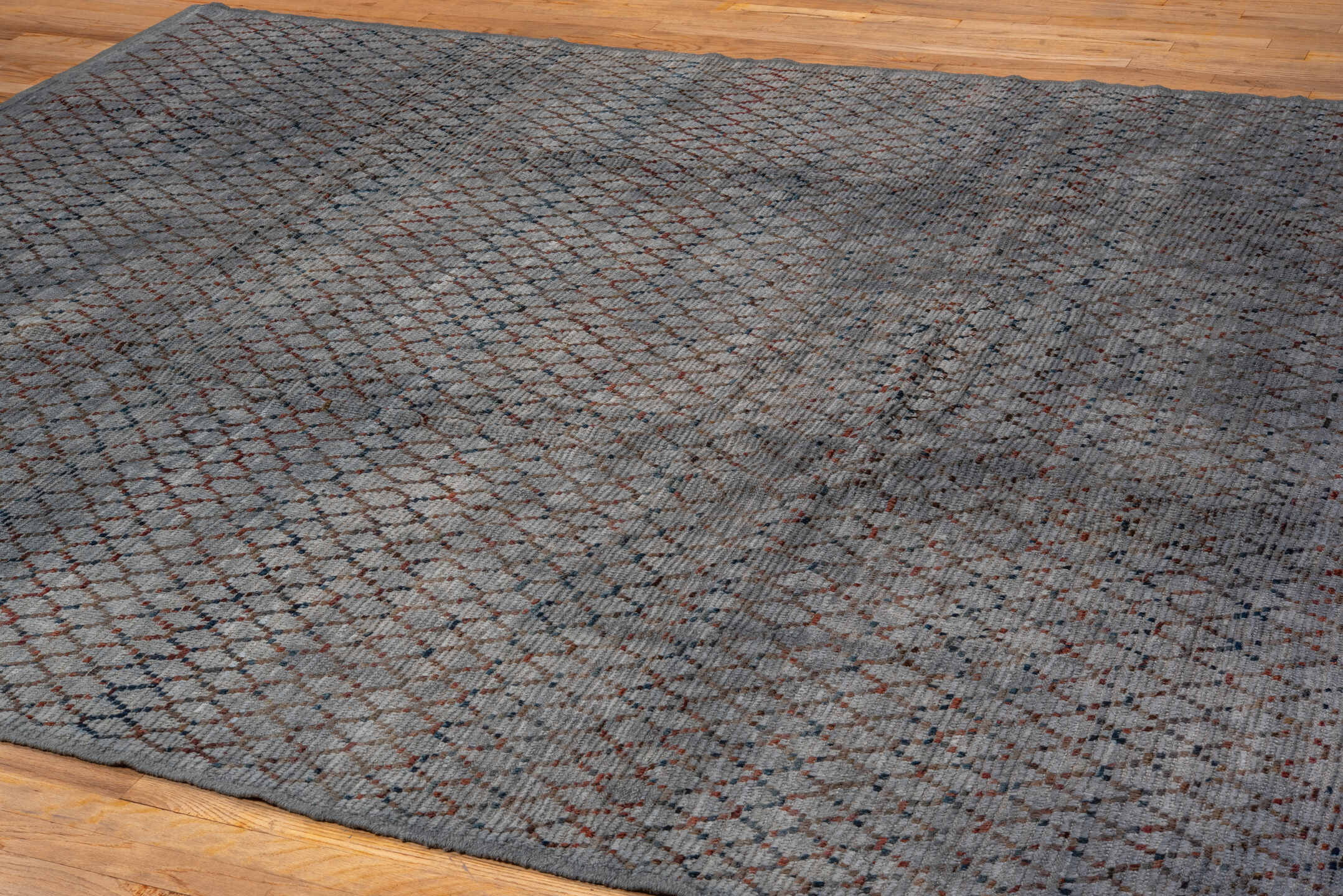 8' x 9' one-of-a-kind handmade vintage Tulu rug. Color palette: blue-gray, slate, rust, charcoal, taupe, gray, blue