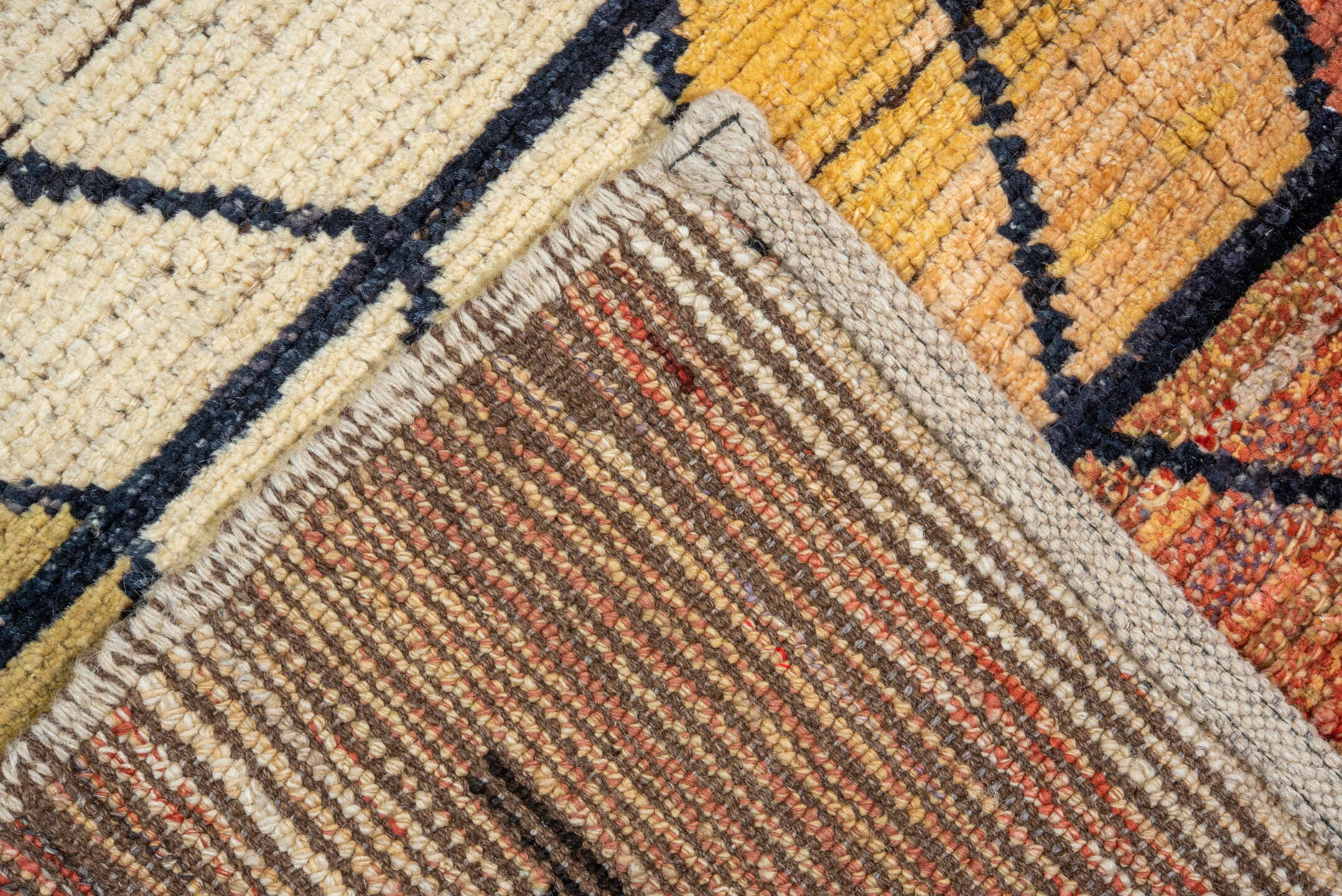 9' x 12' one-of-a-kind handmade vintage Tulu large size rug. Color palette: terra cotta, ivory, rust, peach, gold, violet