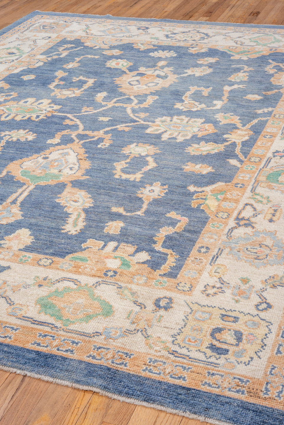 7' x 10' one-of-a-kind handmade vintage Oushak large size rug. Color palette: blue, ivory, peach, mint, tan, terracotta