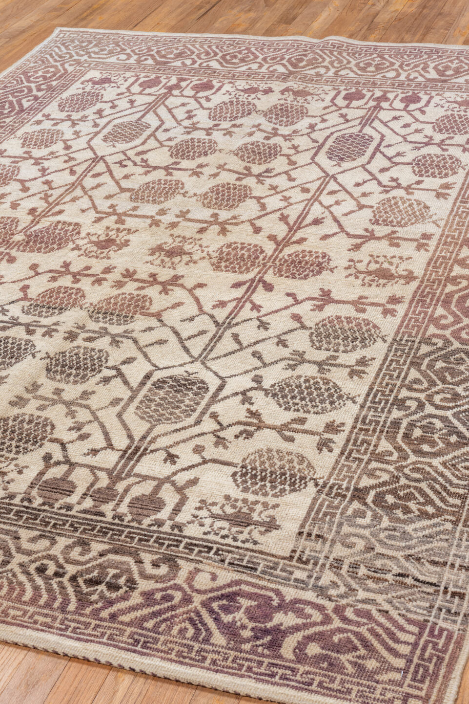 5' x 7' one-of-a-kind handmade vintage Tulu rug. Color palette: brown, gray, light gray, off-white, orange, pink