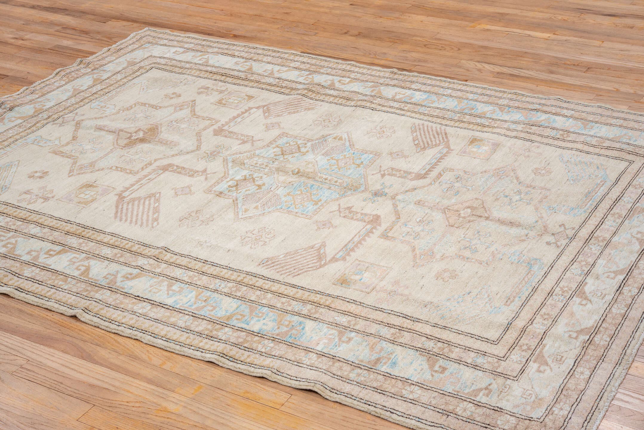 6' x 8' one-of-a-kind handmade vintage Sivas medium size rug. Color palette: ivory, beige, sky blue, taupe, camel, brown