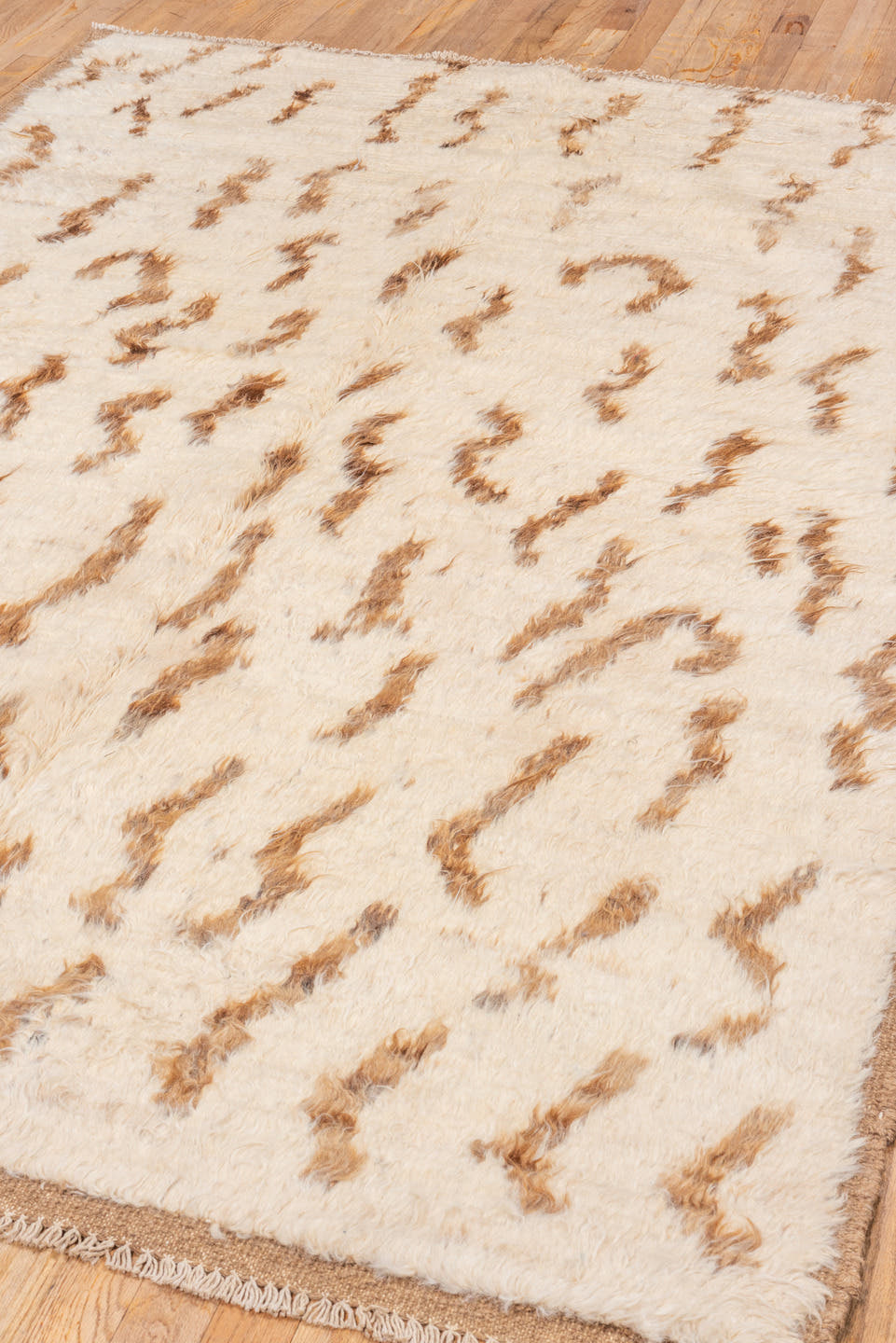 5' x 8' one-of-a-kind handmade vintage Moroccan medium size rug. Color palette: ivory, camel, brown, cream, beige