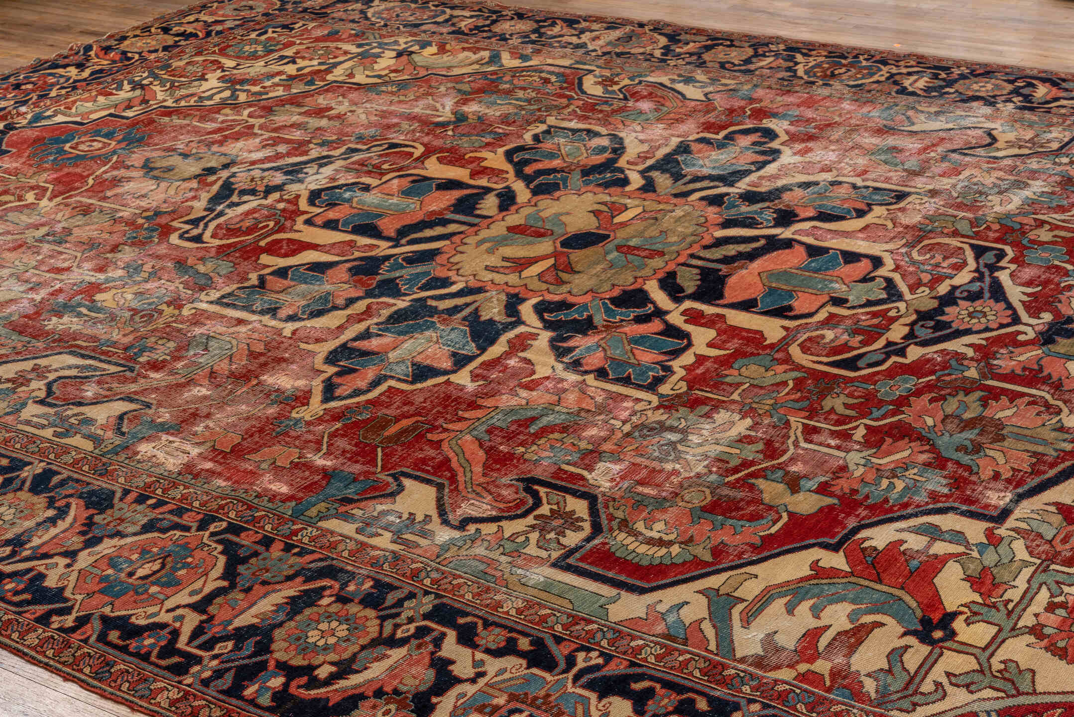 12' x 16' one-of-a-kind handmade vintage Serapi oversize rug. Color palette: red, navy, ivory, rust, sky blue, sage, camel