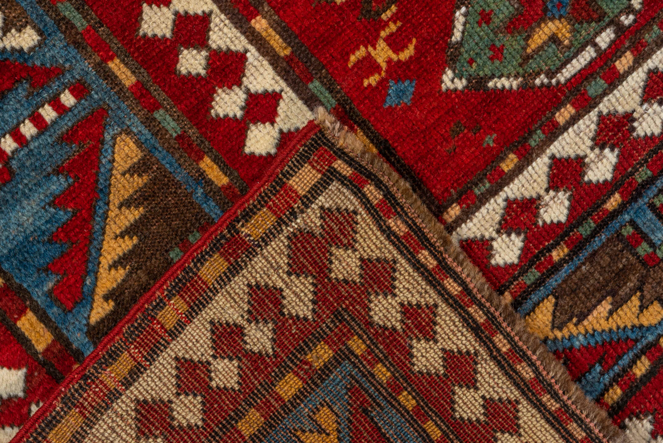 5' x 7' one-of-a-kind handmade vintage Kazak rug. Color palette: red, ivory, sky_blue, navy, brown, sage, camel, light blue