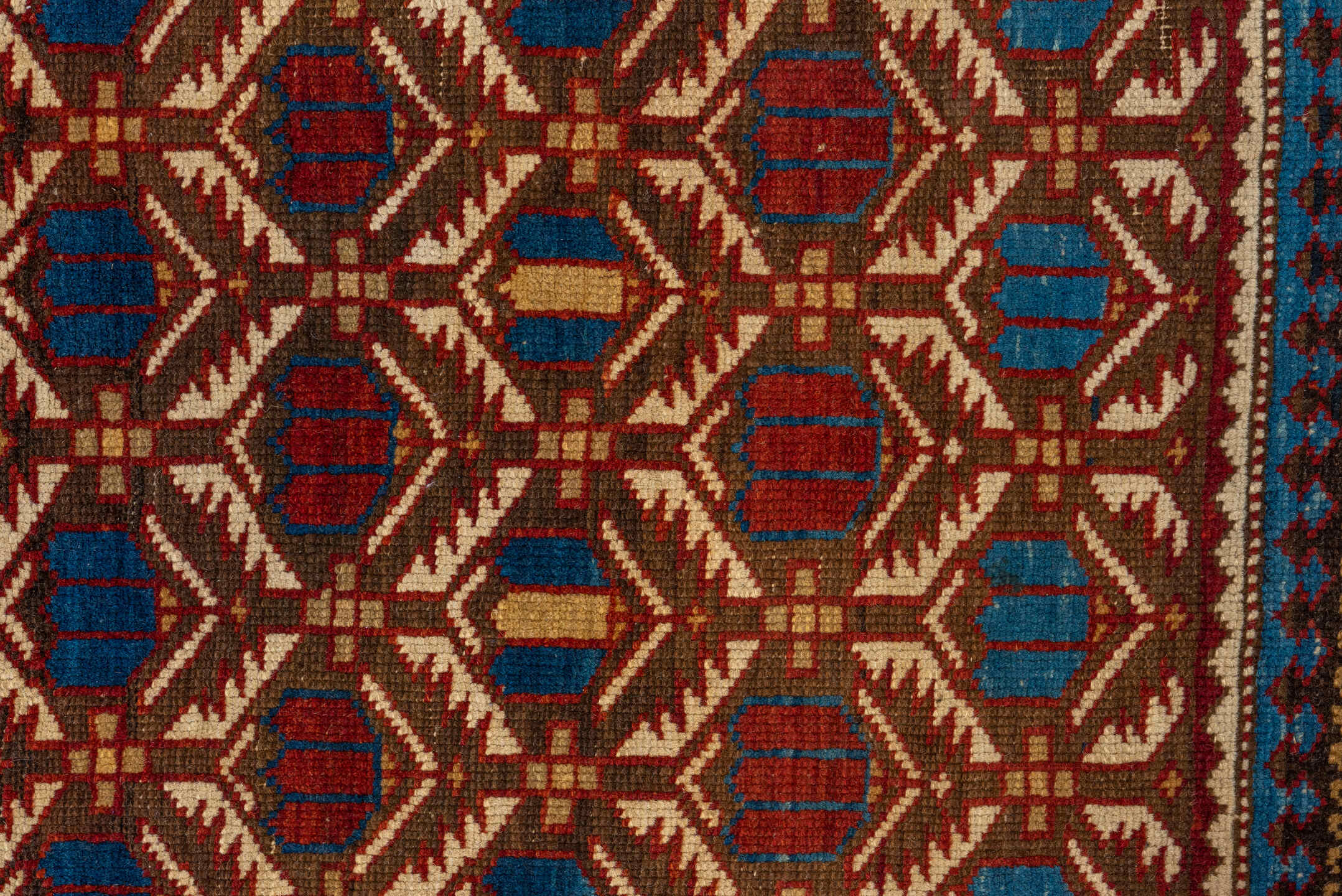 3' x 5' one-of-a-kind handmade vintage Shirvan small size rug. Color palette: ivory, indigo, rust, crimson, brown, camel