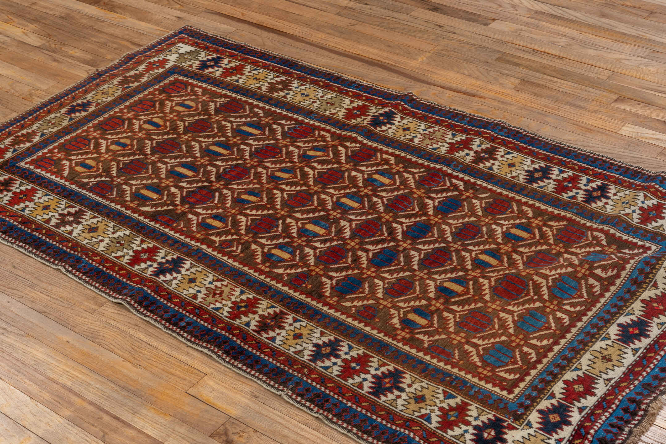 3' x 5' one-of-a-kind handmade vintage Shirvan small size rug. Color palette: blue, brown, dark gray, dark red, gray