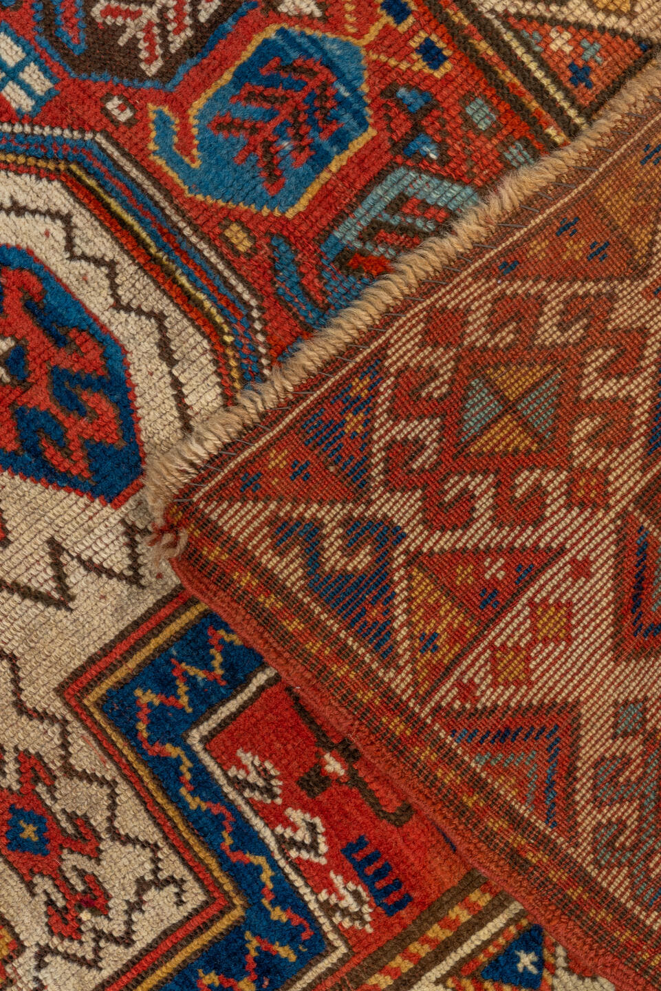 3' x 6' one-of-a-kind handmade vintage Kazak small size rug. Color palette: rust, ivory, navy, gold, crimson, camel, teal