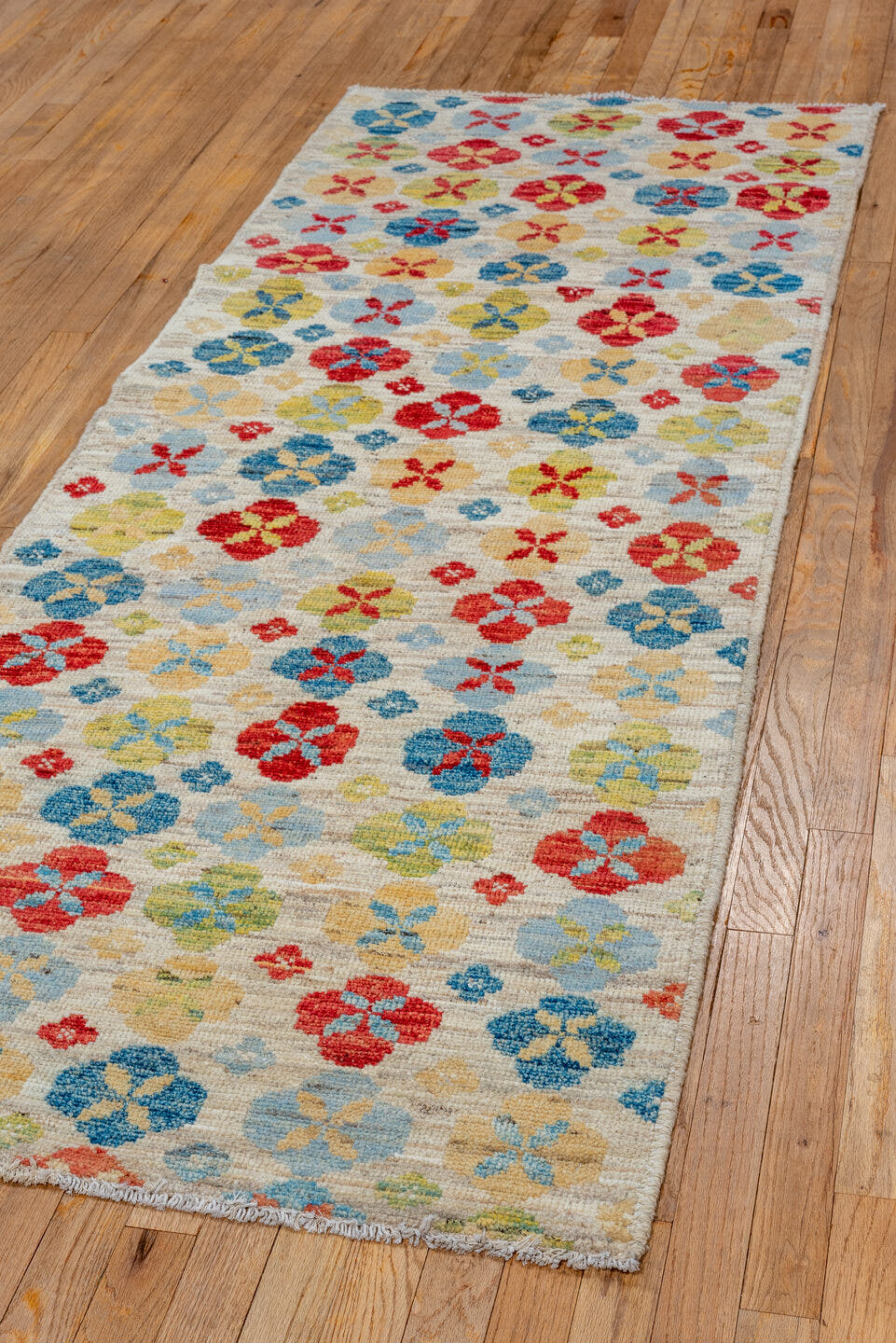 2' x 7' one-of-a-kind handmade vintage Tulu runner rug. Color palette: ivory, red, sky blue, gold, sage, camel, light blue