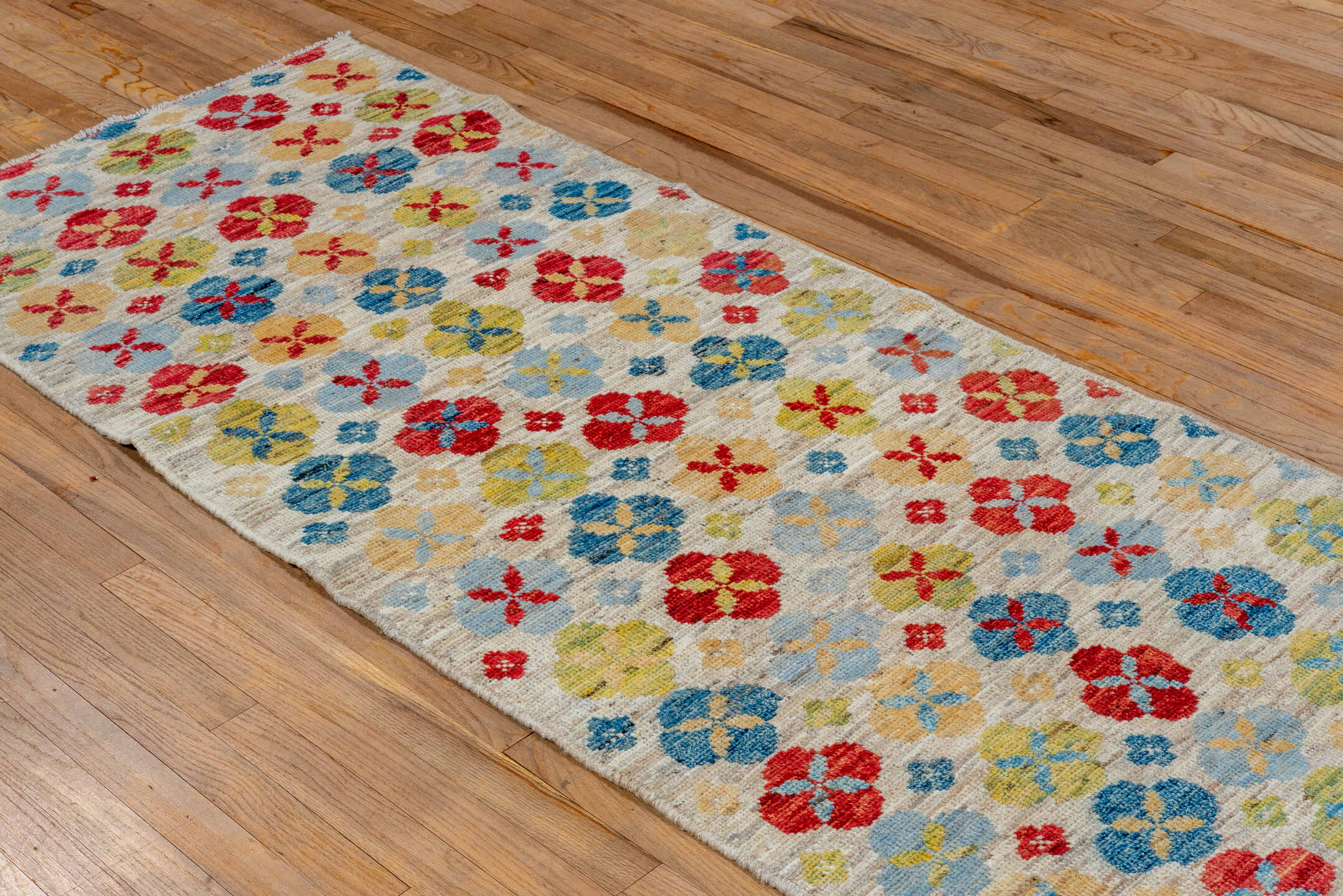 2' x 7' one-of-a-kind handmade vintage Tulu runner rug. Color palette: ivory, red, sky blue, gold, sage, camel, light blue