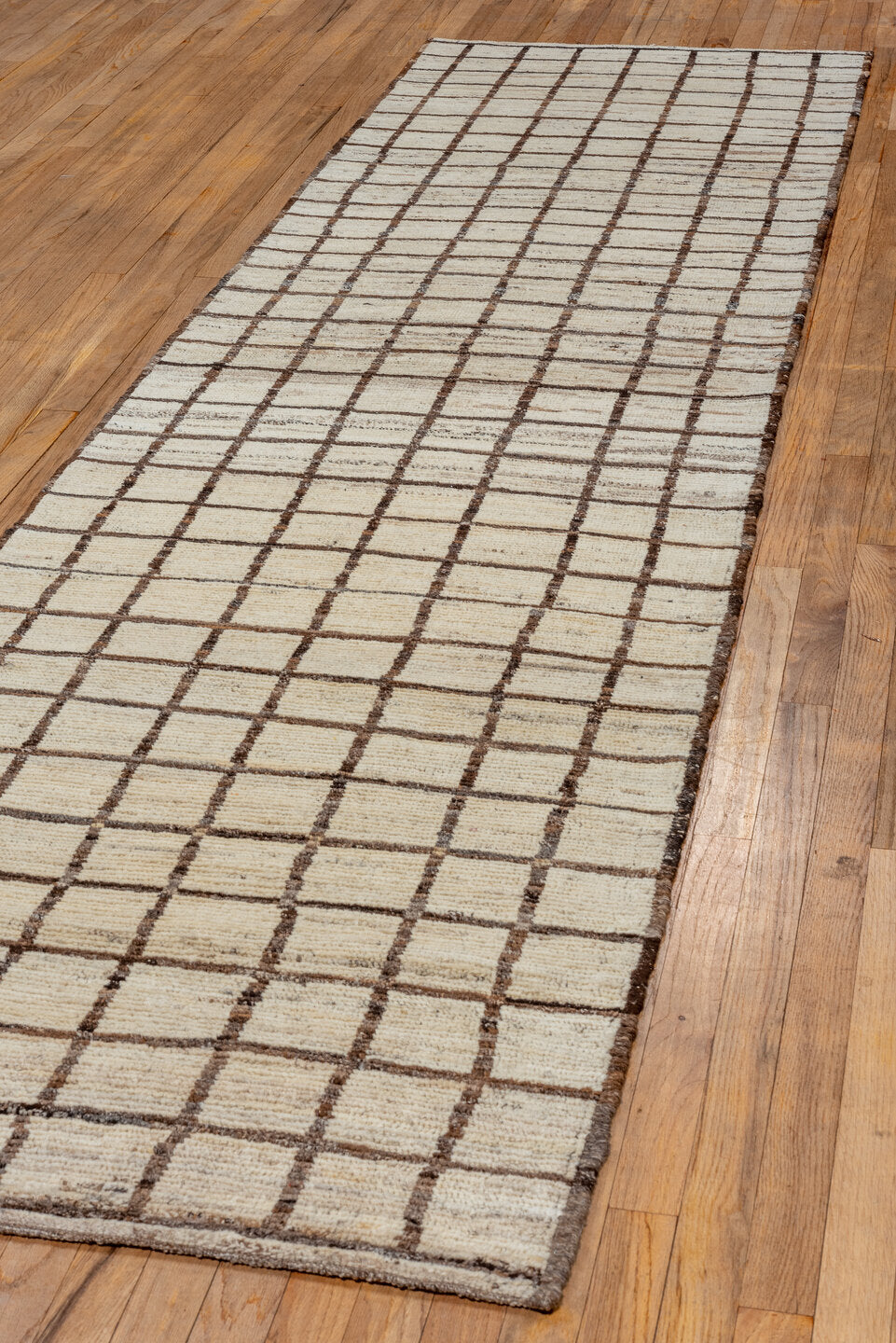 3' x 11' one-of-a-kind handmade vintage Tulu runner rug. Color palette: brown, gray, light gray, off-white, orange, snow