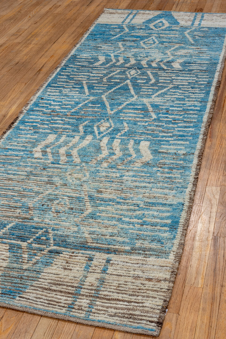 3' x 9' one-of-a-kind handmade vintage Tulu runner rug. Color palette: sky blue, ivory, taupe, brown, light blue, beige
