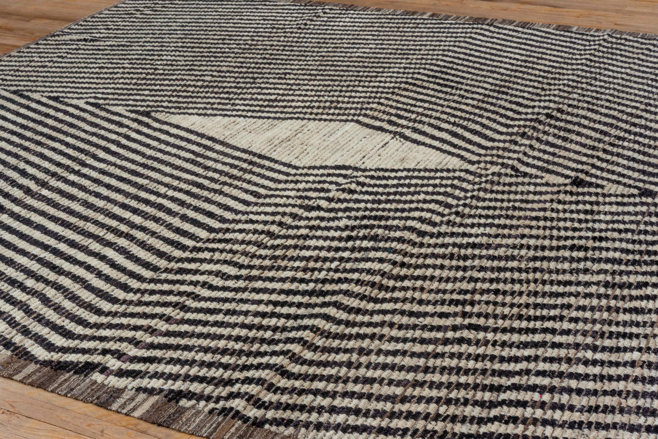 9' x 11' one-of-a-kind handmade vintage Tulu large size rug. Color palette: ivory, charcoal, taupe, brown, gray, black