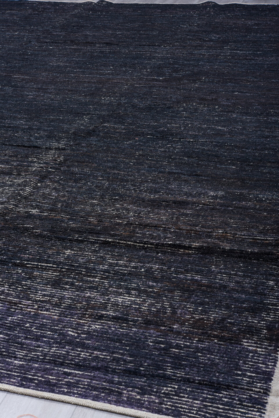 11' x 14' one-of-a-kind handmade vintage Tulu oversize rug. Color palette: charcoal, indigo, ivory, slate, blue gray, black