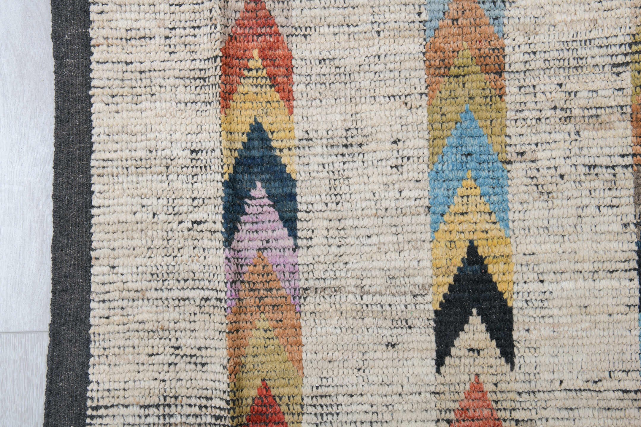 10' x 13' one-of-a-kind handmade vintage Tulu large size rug. Color palette: ivory, charcoal, coral, cobalt, peach, gold